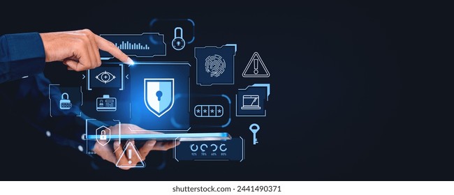 Hands of businessman using tablet computer with immersive cybersecurity interface over dark blue copy space background. Concept of data protection