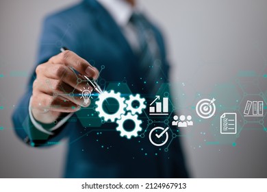 In the hands of a businessman, a virtual innovation. Business Process and Problem Solving, Workflow Monitoring and Evaluation as well as Quality Control are all part of Operations Management. - Shutterstock ID 2124967913