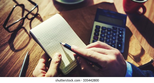 Hands of Businessman Working with Calculator Concept