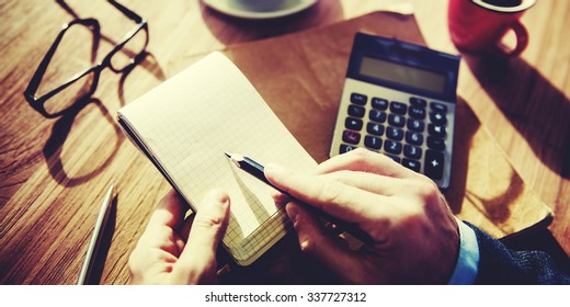 Hands of Businessman Working with Calculator Concept