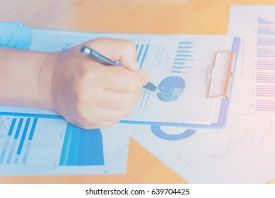 Hands of Businessman working on Laptop Computer with Data Charts - Shutterstock ID 639704425