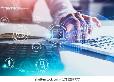 Hands of businesswoman typing on laptop at blurry table with double exposure of futuristic online business interface. Concept of internet and working from home during coronavirus pandemic. Toned image - Powered by Shutterstock