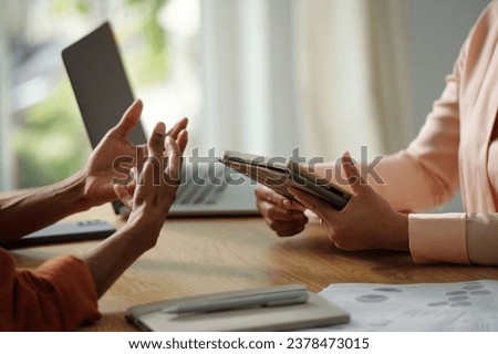 Hands of candidate actively gesturing when talking to HR manger in meeting