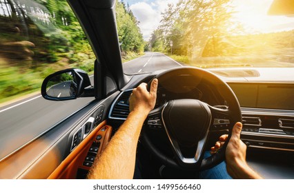 Hands Of Car Driver On Steering Wheel, Driving Car At Summer Day On A Country Road, Having Fun Driving The Empty Highway On Tour Journey - POV, First Person View Shot