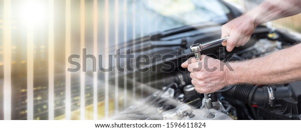 Hands of car mechanic repairing a car engine;\
multiple exposure