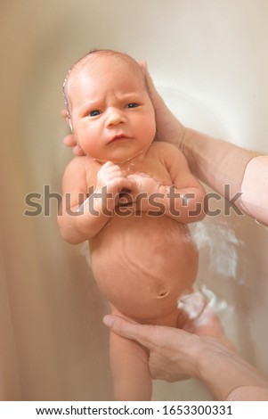 Similar – Newborn in the bathtub