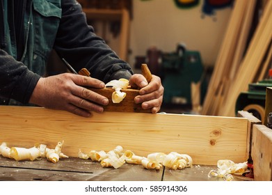 Hands Of A Carpenter Planed Wood