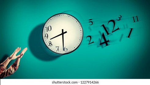 Hands Catching A Clock With Numbers Detached In The Air. Lack Of Time Concept . The Concept Of Time Passing Quickly.

