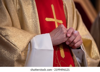 Hands Of A Catholic Priest In A Cassock