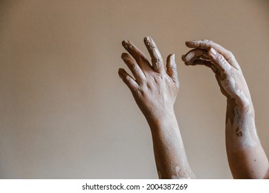 Hands of ceramist are smeared with clay after she sculpted pottery - Powered by Shutterstock