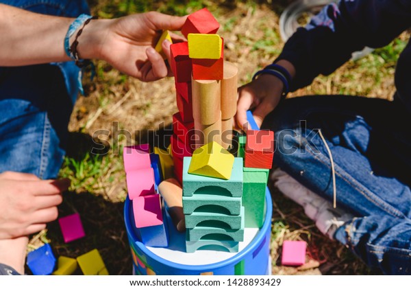 Hands Children Playing Colored Blocks On Stock Photo 1428893429