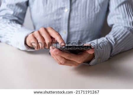 hands clicking on a mobile phone, communication concept, telephony, networks and communications, selective focus