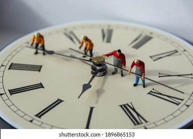 Hands Of A Clock In The Passage Time. Miniature Concept.