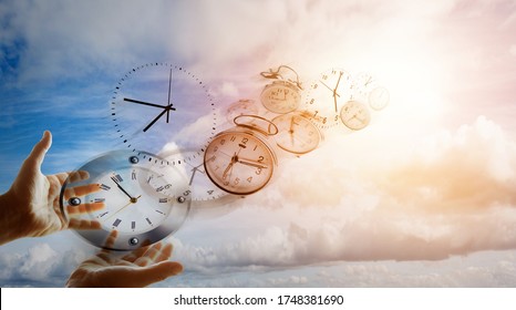Hands and clocks in sky
