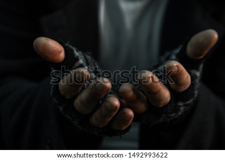 hands close up poor old man or beggar begging you for help sitting at dirty slum. Concept for poverty or hunger people,human Rights,donate and charity