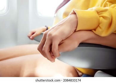 Hands Close-up In Front Of An Airplane Window, Fear Of Flying, The Cabin Of A Passenger Airliner. Aerophobia, Phobia, International Flights, Stress, Motion Sickness