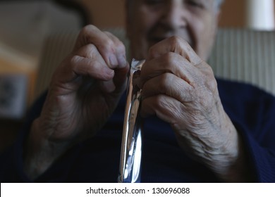 Hands, Closeup Wrinkled Hands Of An Old Senior Woman Or Man Opening Package Of Chocolate Or Junk Food. Body Part Of Old People Concept Photo