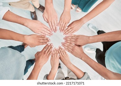 Hands, Collaboration And Motivation With A Business Team Standing In A Huddle Or Circle From Above. Teamwork, Goal And Unity With A Man And Woman Employee Group Together In The Office For Support