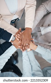 Hands, Collaboration And Solidarity With A Team Of Business People Standing In A Huddle Or Circle In The Office From Above. Teamwork, Motivation And Unity With A Man And Woman Employee Group At Work