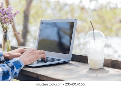 Hands of contemporary young office manager on laptop keyboard during working, surfing net, shopping online or online job. close up pictures - Shutterstock ID 2354314155