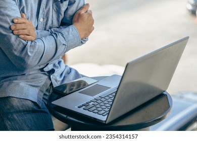 Hands of contemporary young office manager on laptop keyboard during working, surfing net, shopping online or online job. close up pictures - Shutterstock ID 2354314157
