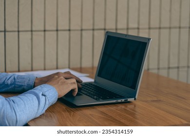 Hands of contemporary young office manager on laptop keyboard during working, surfing net, shopping online or online job. close up pictures - Shutterstock ID 2354314159
