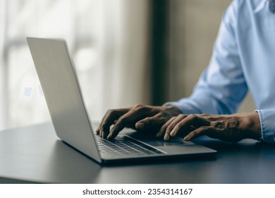 Hands of contemporary young office manager on laptop keyboard during working, surfing net, shopping online or online job. close up pictures - Shutterstock ID 2354314167