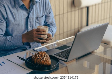 Hands of contemporary young office manager on laptop keyboard during working, surfing net, shopping online or online job. close up pictures - Shutterstock ID 2354314173