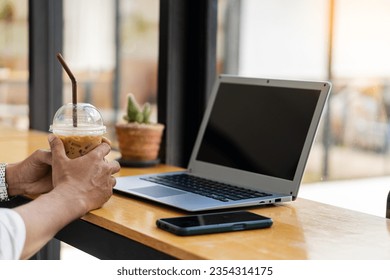 Hands of contemporary young office manager on laptop keyboard during working, surfing net, shopping online or online job. close up pictures - Shutterstock ID 2354314175