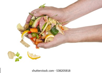 From Hands Of The Cook Food Waste Falls On A Table. Isolated Studio Shot