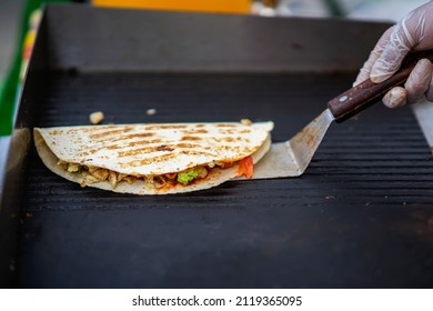 Hands Of Cook Preparing Fajita Wrap With Beef, Chicken And Vegetable Salad. National Food. Party Food