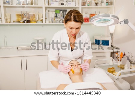 Similar – Female doctor giving medication to elderly patient