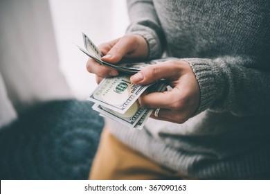 Hands counting us dollar bills. Toned picture - Shutterstock ID 367090163