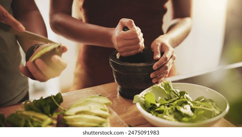 Hands, couple and healthy food in kitchen with avocado, vegetables and leaves for breakfast or lunch. People with support, helping and cooking together at home for nutrition and care with green meal - Powered by Shutterstock