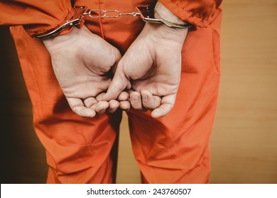 Hands Of Criminal With Handcuffs In The Court Room