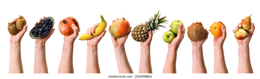 Hands of crop anonymous people holding various ripe fruits and berries on white background during harvesting season in light studio - Shutterstock ID 2256998861