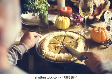 Hands Cutting Pumpkin Pie Thanksgiving Holiday Celebration Concept