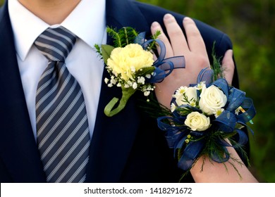 Hands of date Prom night flowers corsage formal wear