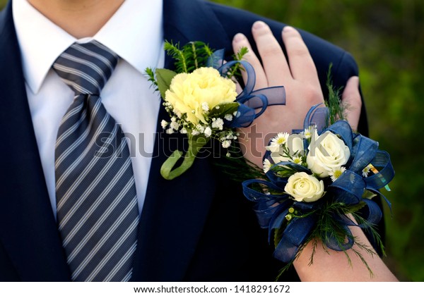 Hands of\
date Prom night flowers corsage formal\
wear
