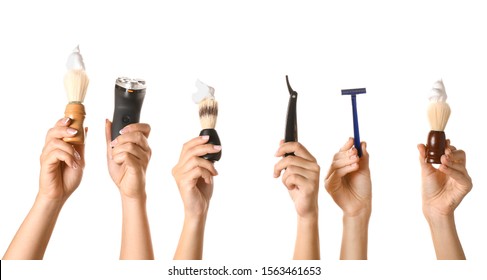 Hands with different tools for shaving on white background - Shutterstock ID 1563461653