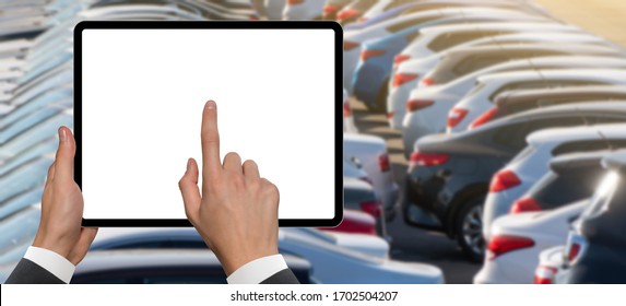 Hands With Digital Tablet On A Background Of Rows Of Cars. Car Sales.