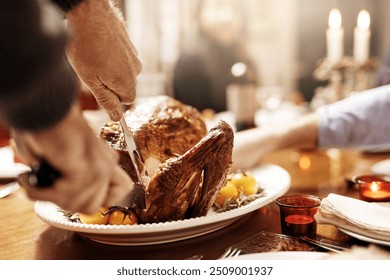 Hands, dinner and cutting turkey for thanksgiving celebration, festive holiday or feast. People, food and carving meat in home for social gathering, event or party with family eating together closeup - Powered by Shutterstock