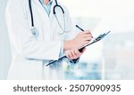 Hands, doctor and clipboard writing notes for hospital schedule, history record or healthcare checklist. Paper, documents or person with life insurance with medical aid, prescription or test results