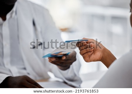 Hands of doctor giving flyer to patient about hospital help, medical clinic contact us information. Sick black woman with health problem consulting a professional healthcare worker, nurse or expert