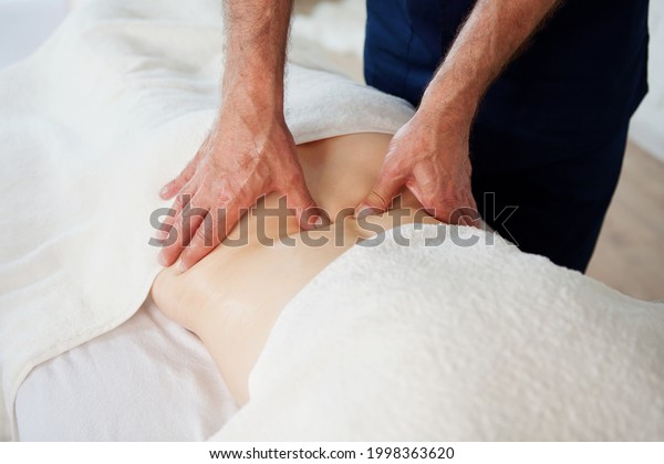 Hands of\
doctor masseur chiropractor pushing on back points and making\
acupressure treatment for woman patient. Beauty treatment, massage\
bodycare in medical clinic from\
professional