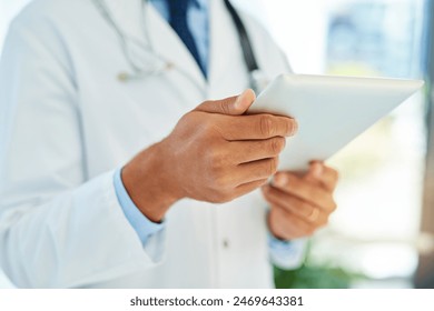 Hands of doctor, tablet and medical care in hospital for patient diagnosis, health charts or consultation. Online, wellness and physician in clinic for telehealth, review analysis or schedule surgery - Powered by Shutterstock