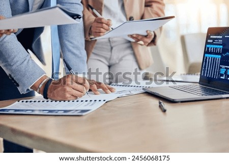 Hands, documents and laptop with chart for group, crypto and investment with analysis in office. Business people, computer and graph in trading, signature or stock market with paperwork for agreement