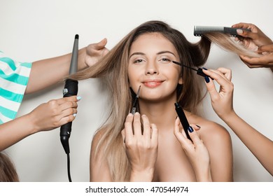 Hands doing hairstyle and make up young beautiful naked girl. - Shutterstock ID 470544974