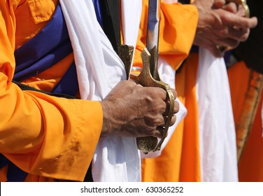 Hands Of An Elder Sikh Man Who Hold The Sword