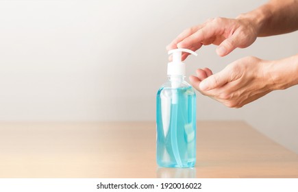 Hands of an elderly man taking alcohol-based hand sanitizer as it's one of the most important new normal habits to preventing the spread. Stay healthy stay safe during Covid 19 pandemic awareness.  - Powered by Shutterstock